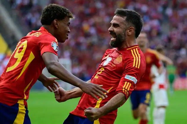 Dani Carvajal celebrates with Lamine Yamal against Croatia