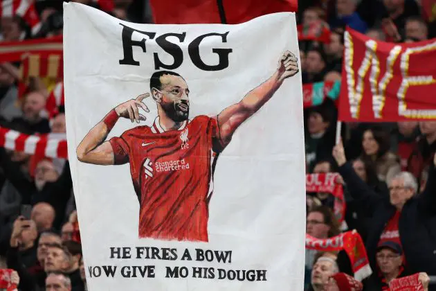 Liverpool fans hold up a banner calling for Salah to be given a new deal.
