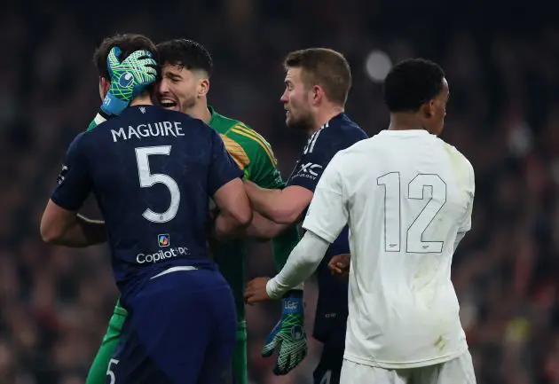 Man Utd celebrate Bayindir's penalty save