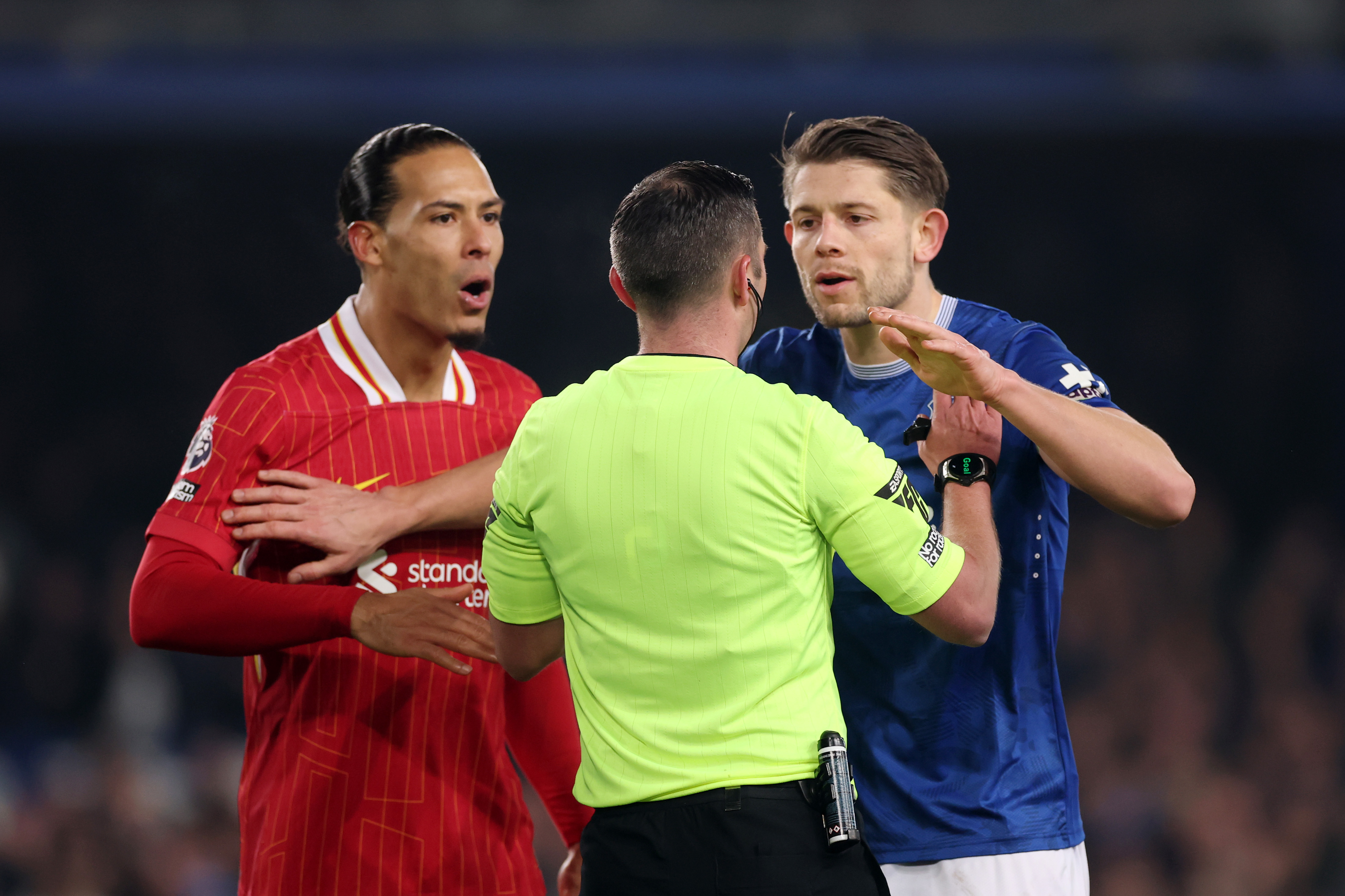 Virgil van Dijk, James Tarkowski and referee Michael Oliver