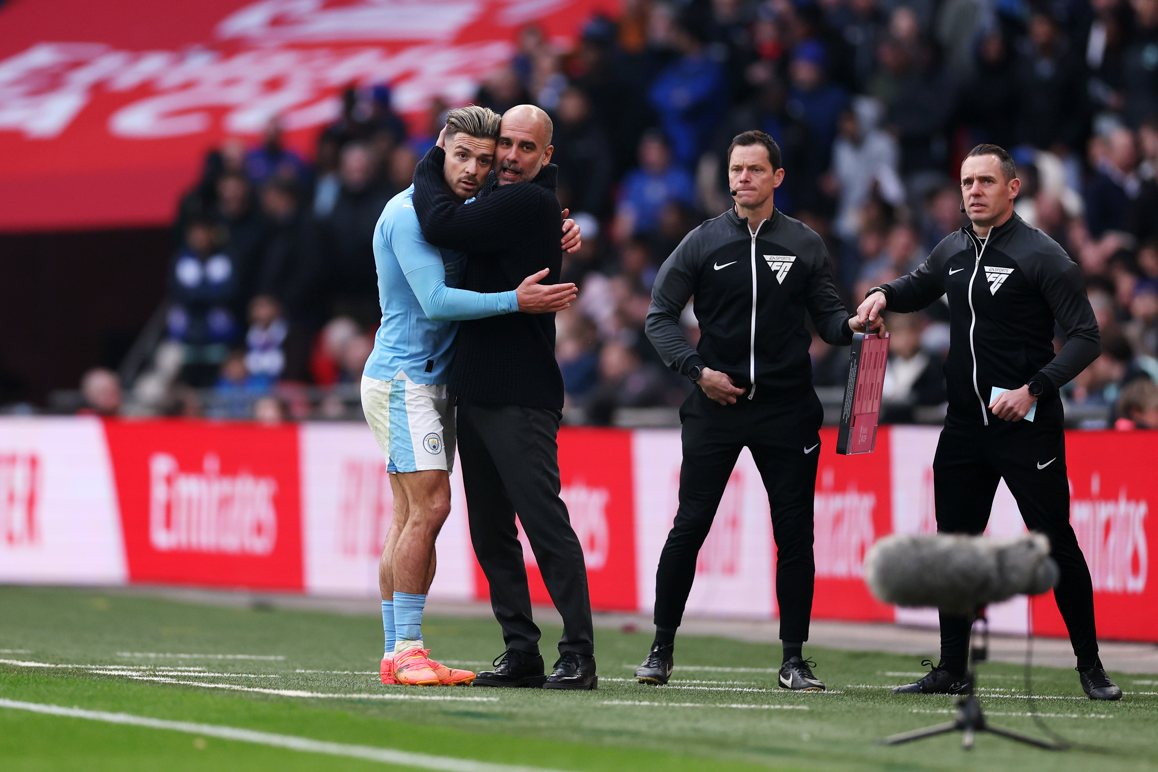 Pep Guardiola and Jack Grealish