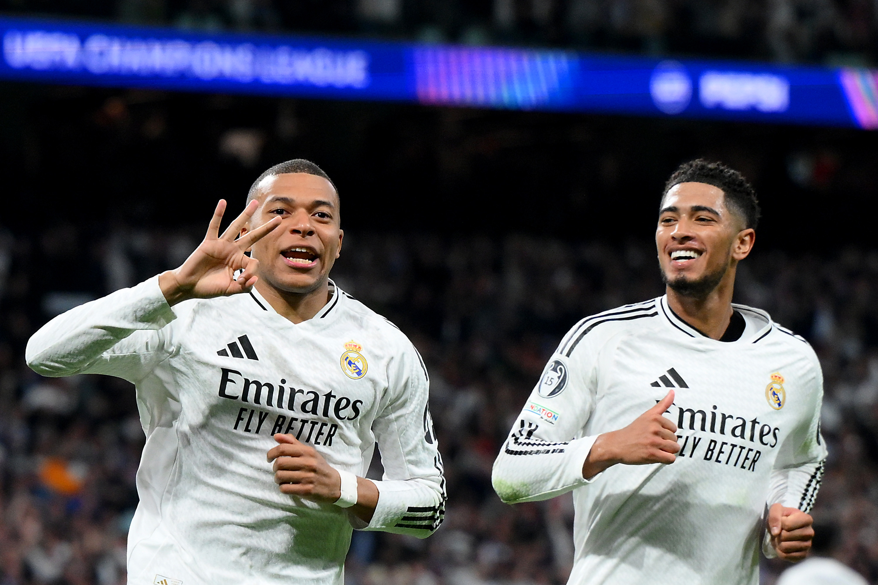 Kylian Mbappe celebrates his hat-trick with Jude Bellingham