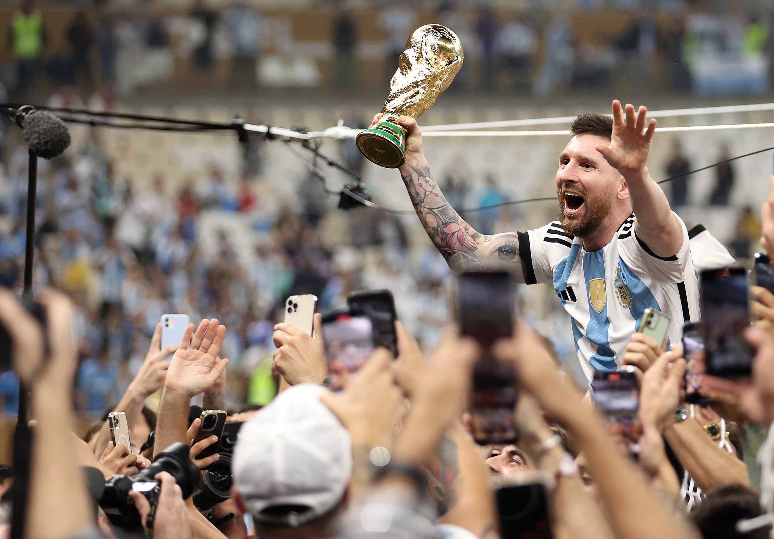 Lionel Messi with the World Cup