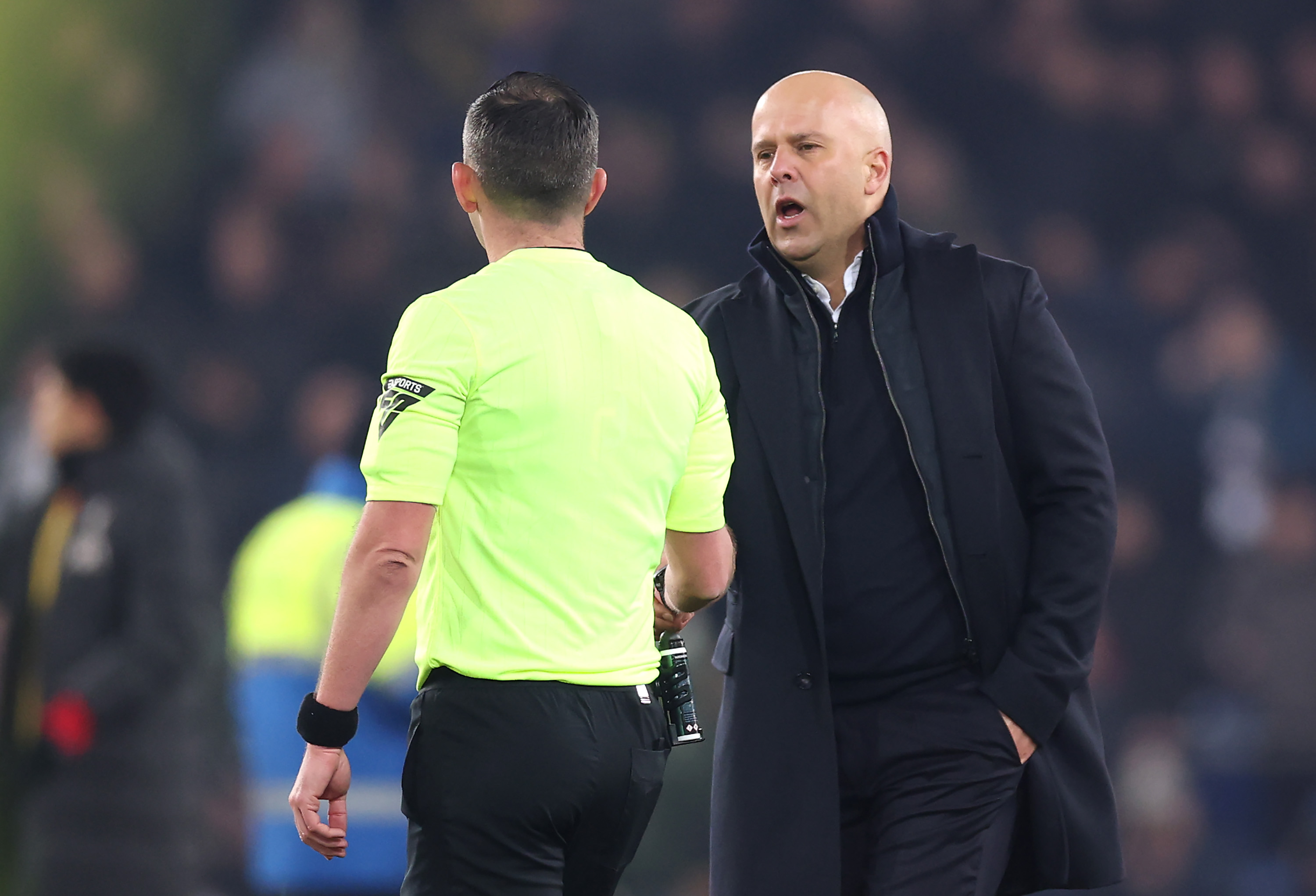 Liverpool boss Arne Slot and referee Michael Oliver
