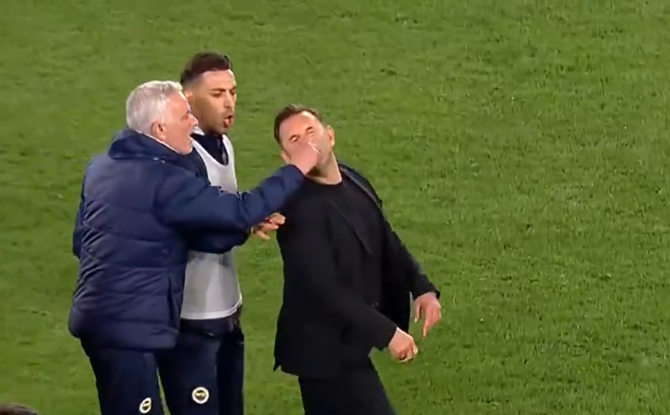 Jose Mourinho appearing to grab the nose of Okan Buruk