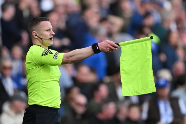 A linesman flags for offside