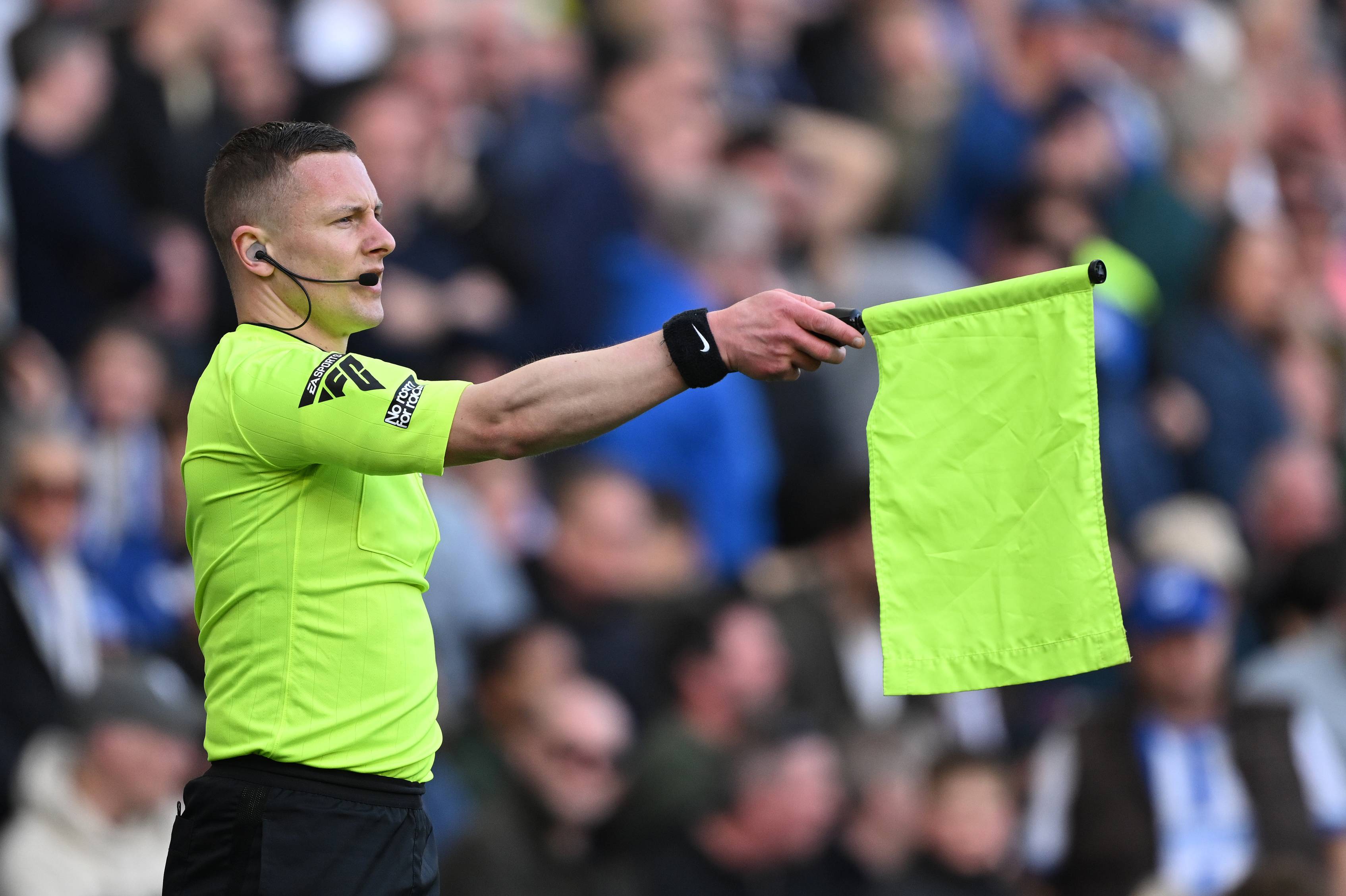 A linesman flags for offside