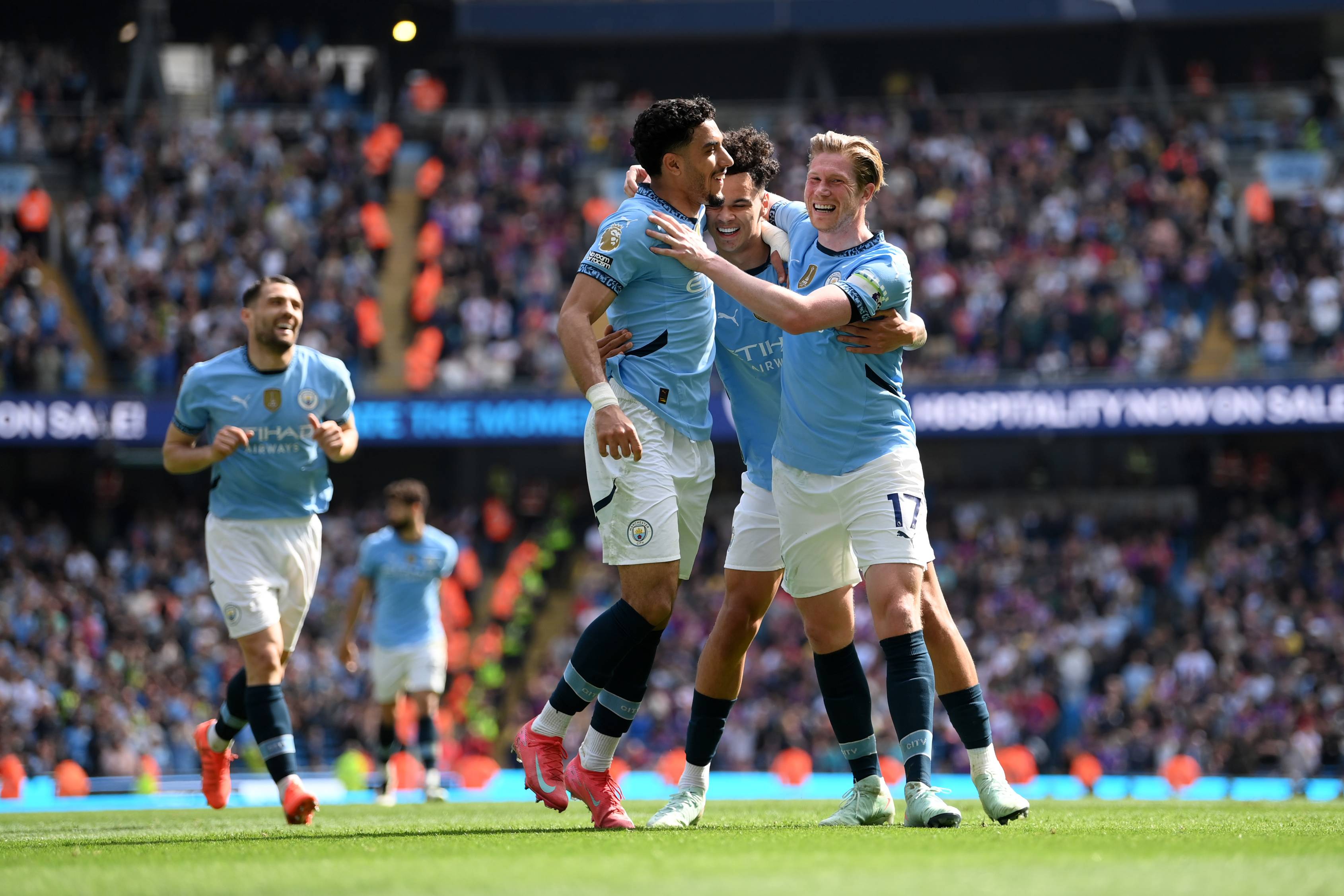 Kevin De Bruyne celebrates with his Man City team-mates