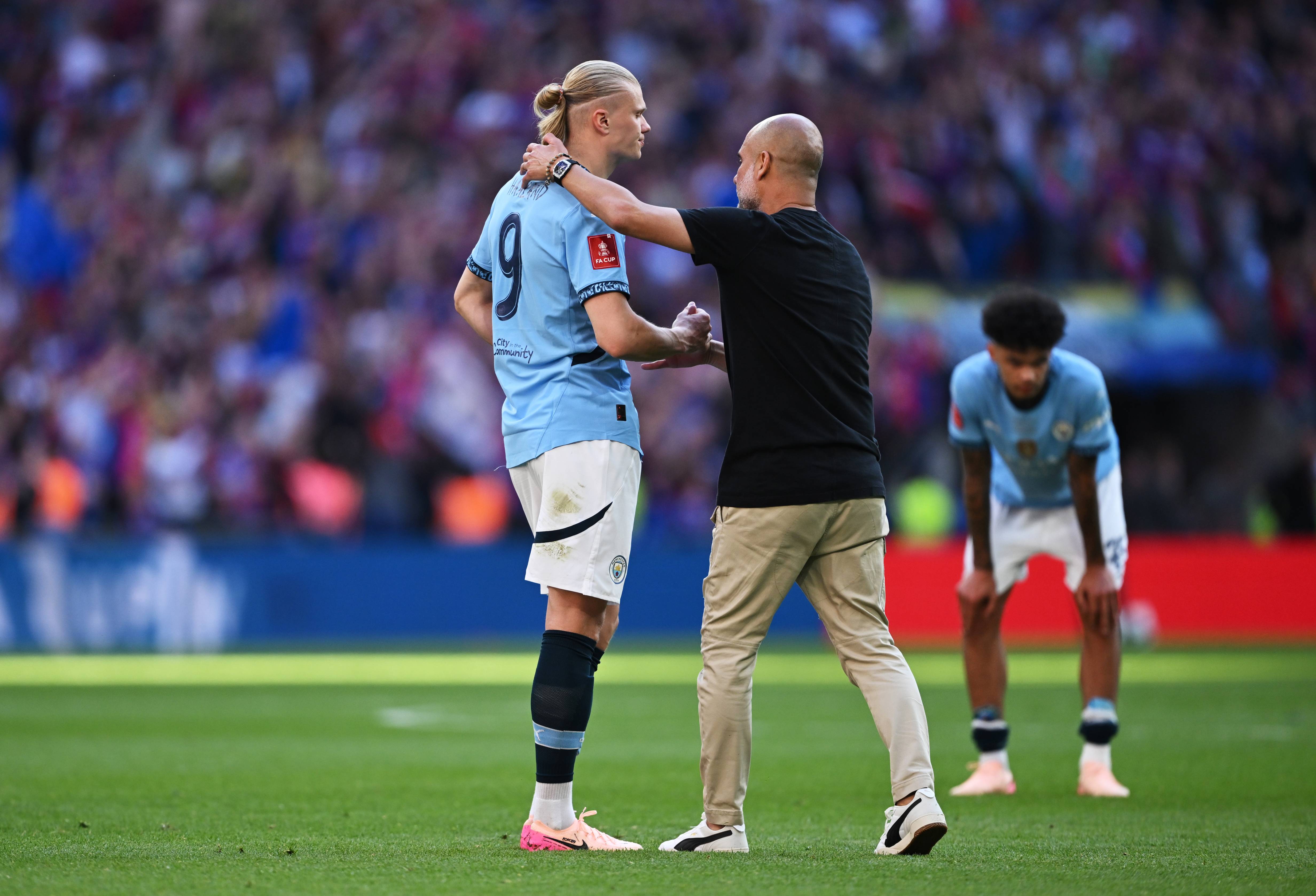 Pep Guardiola and Erling Haaland