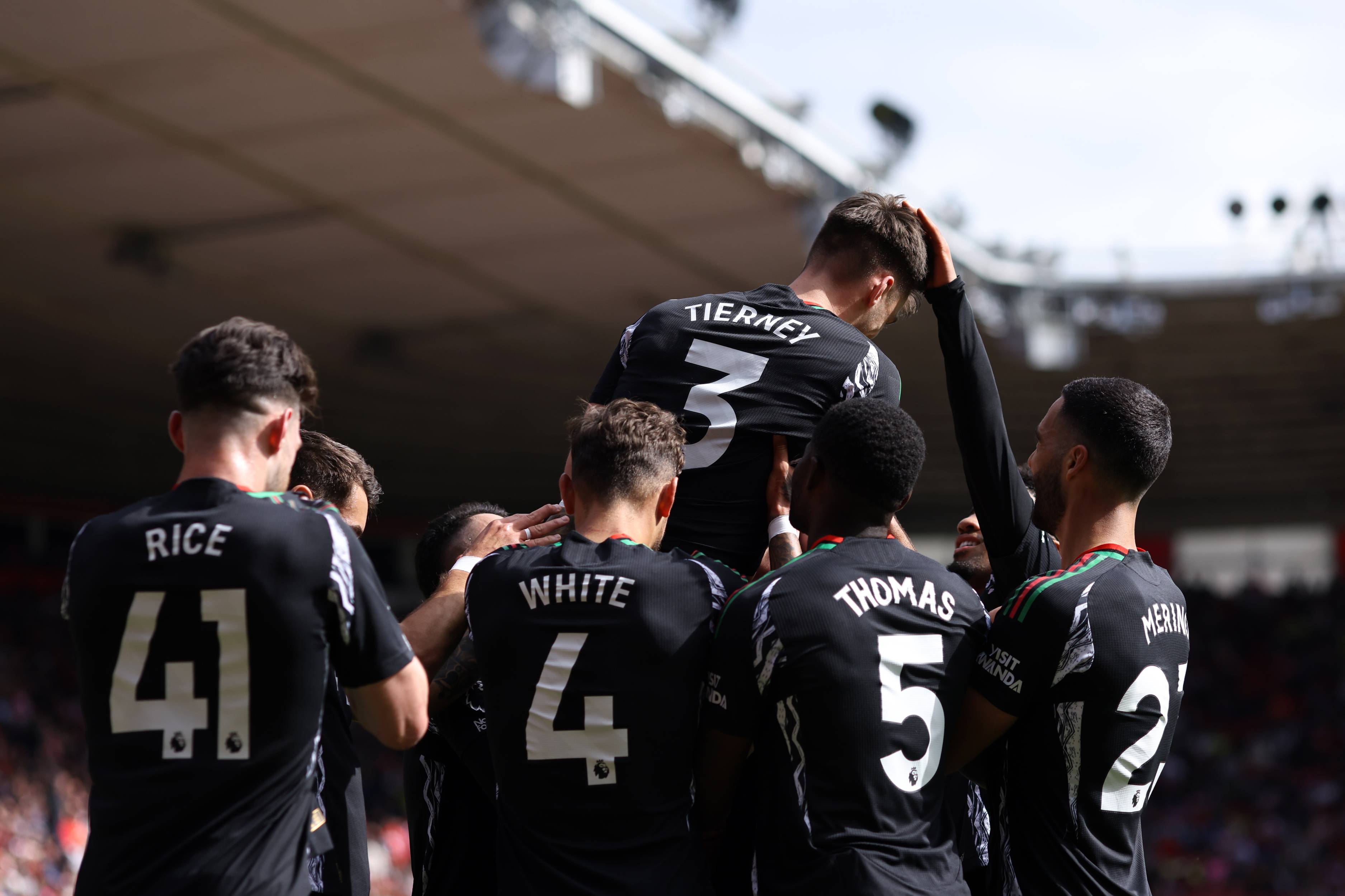 Arsenal players celebrate with Kieran Tierney
