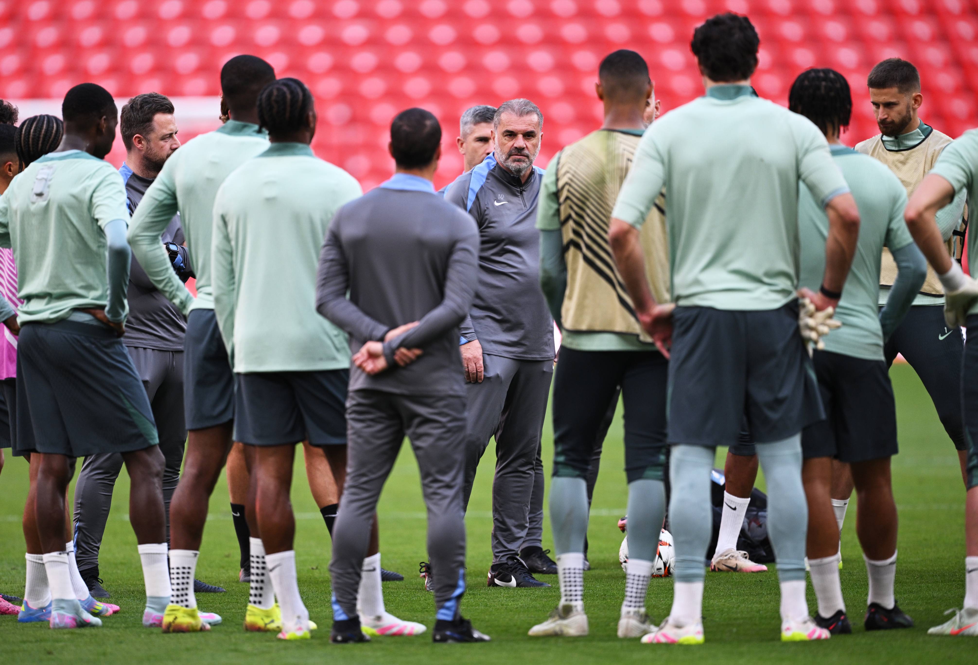 Tottenham boss Ange Postecoglou speaks to his players