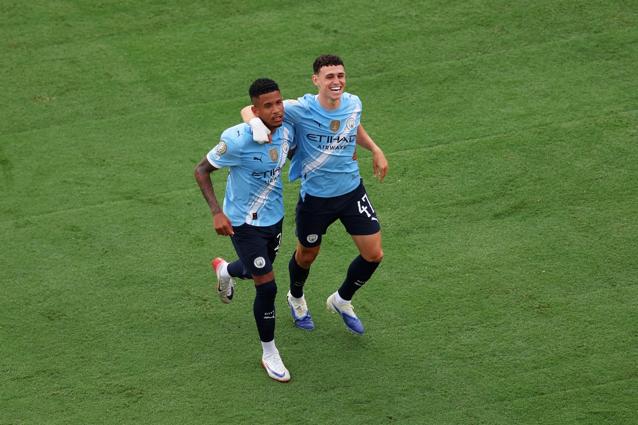 Phil Foden and Savinho celebrate against Juventus (Photo by Megan Briggs/Getty Images) via ONE FOOTBALL