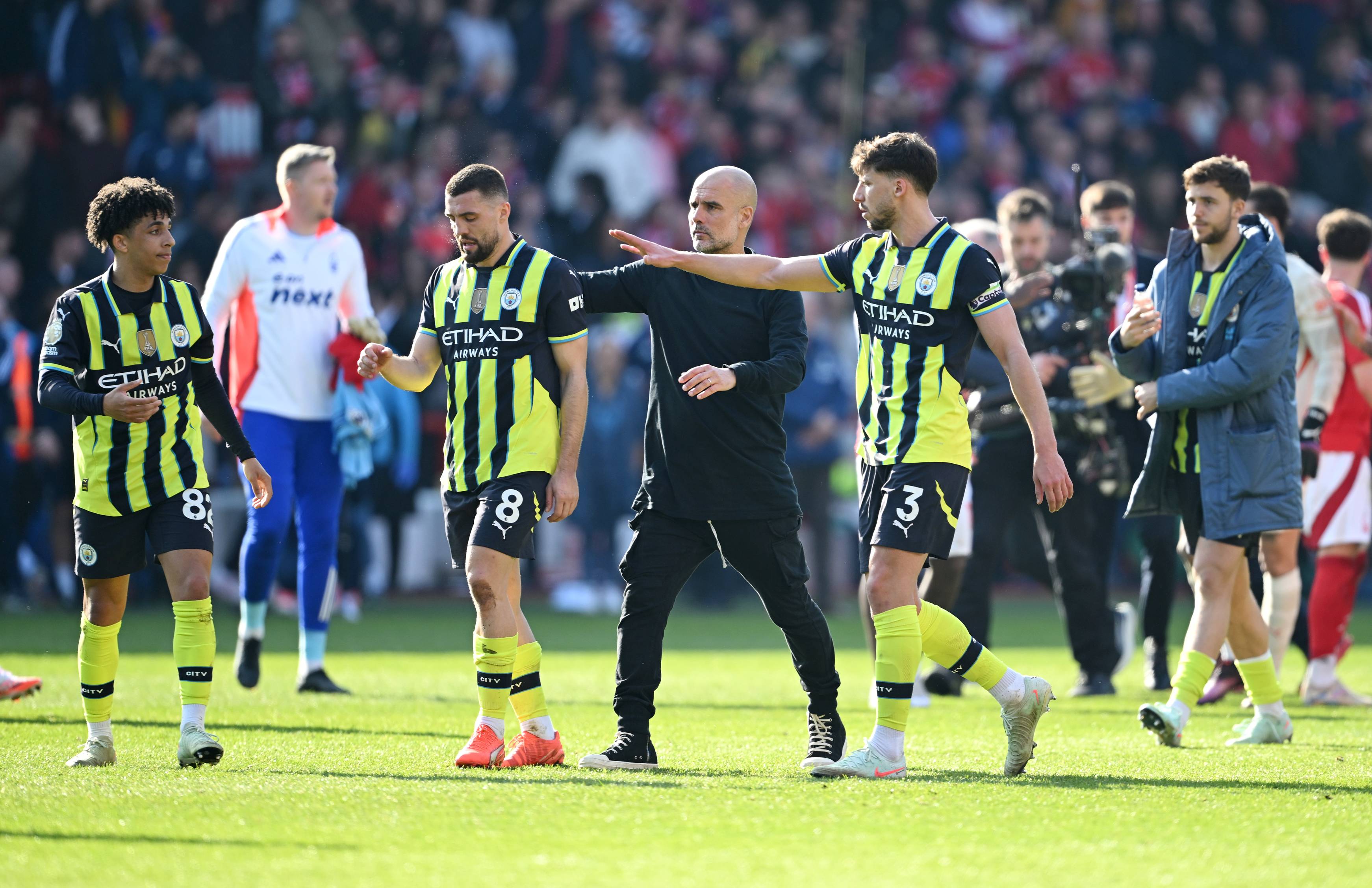 Pep Guardiola and some of his Man City players