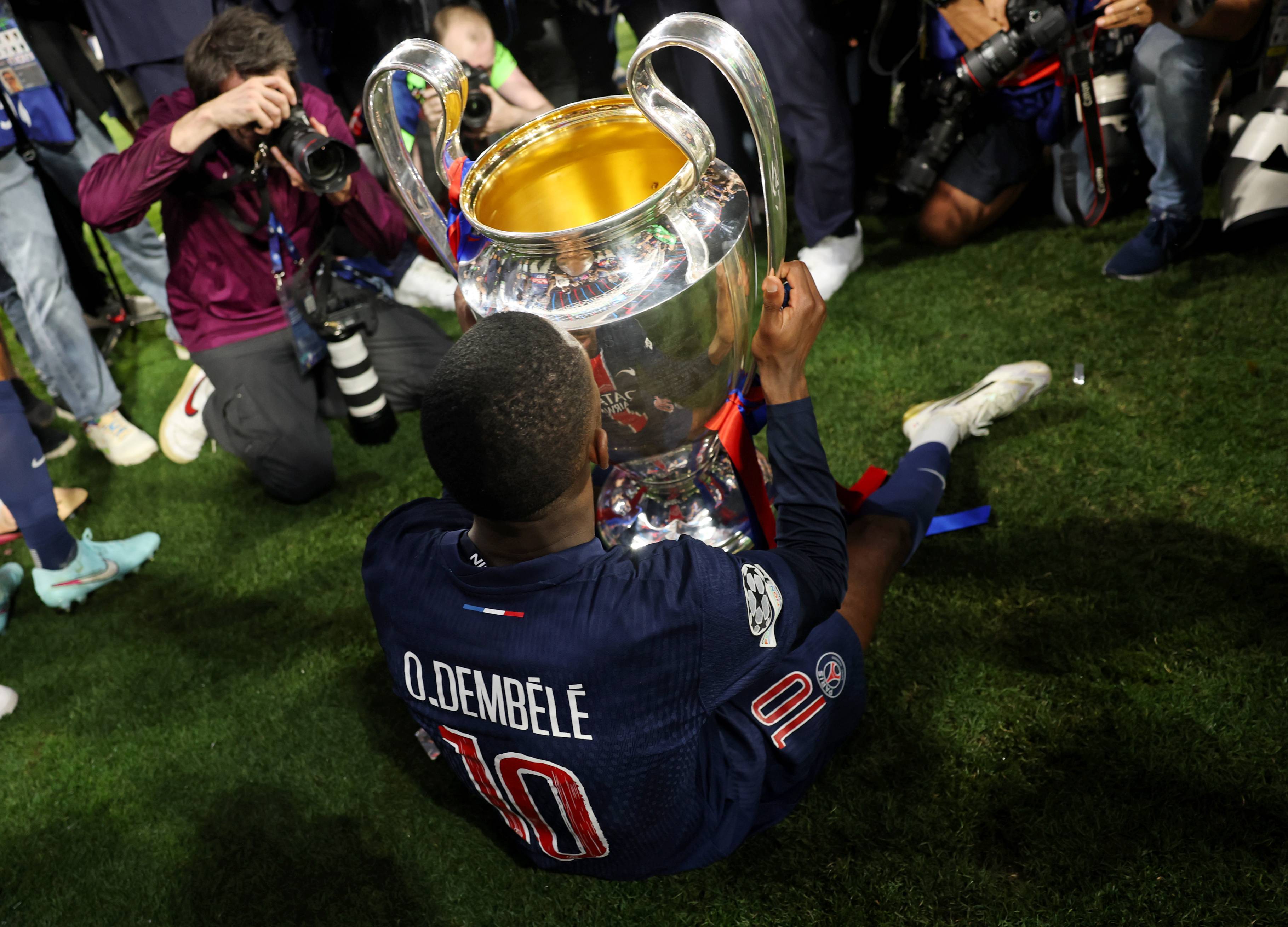 Ousmane Dembele with the Champions League trophy