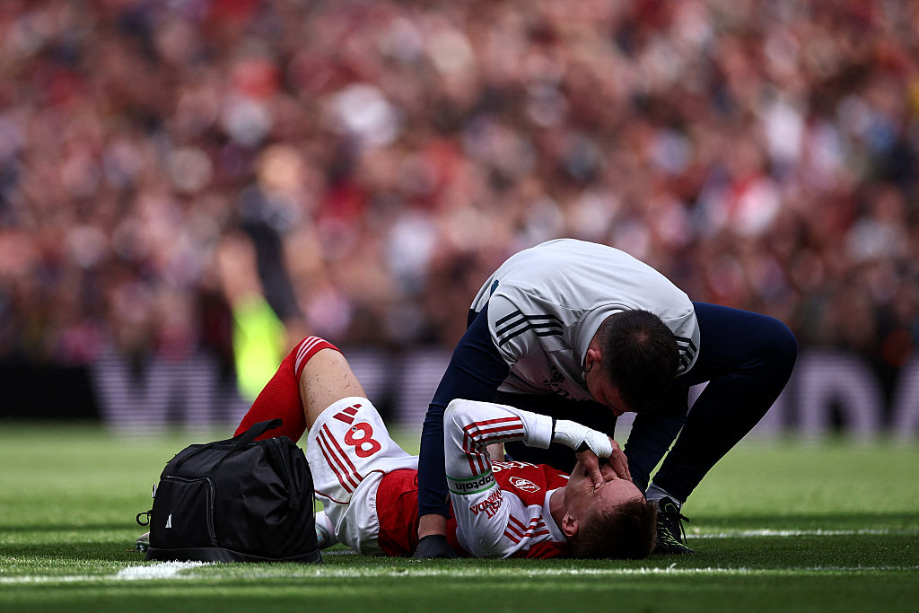 Martin Odegaard goes down injured against Nottingham Forest