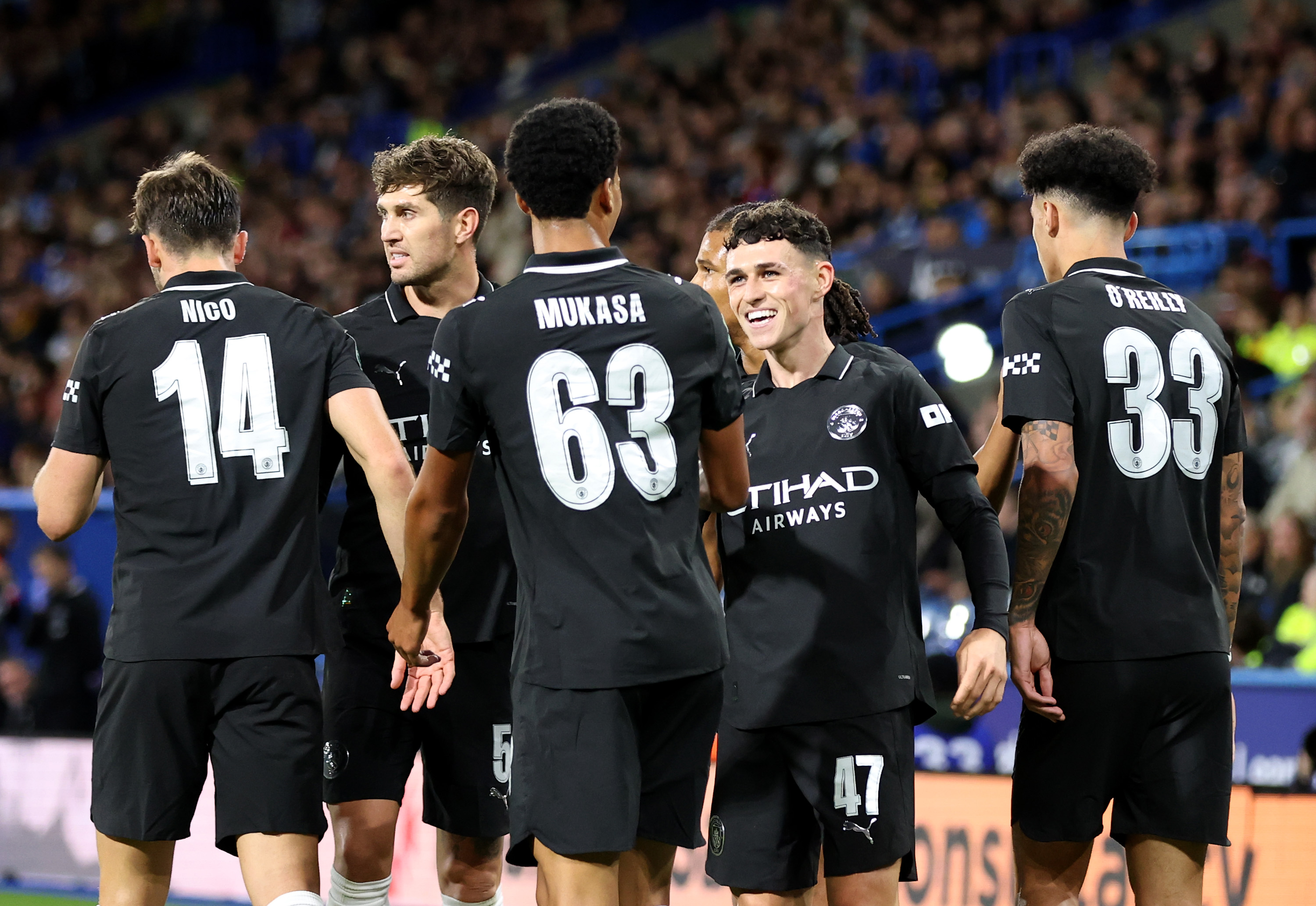 Man City celebrate against Huddersfield