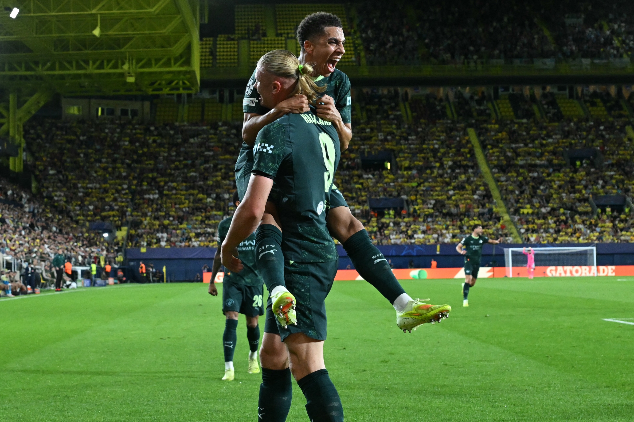 Erling Haaland and Rico Lewis celebrate (Photo by JAVIER SORIANO/AFP via Getty Images)