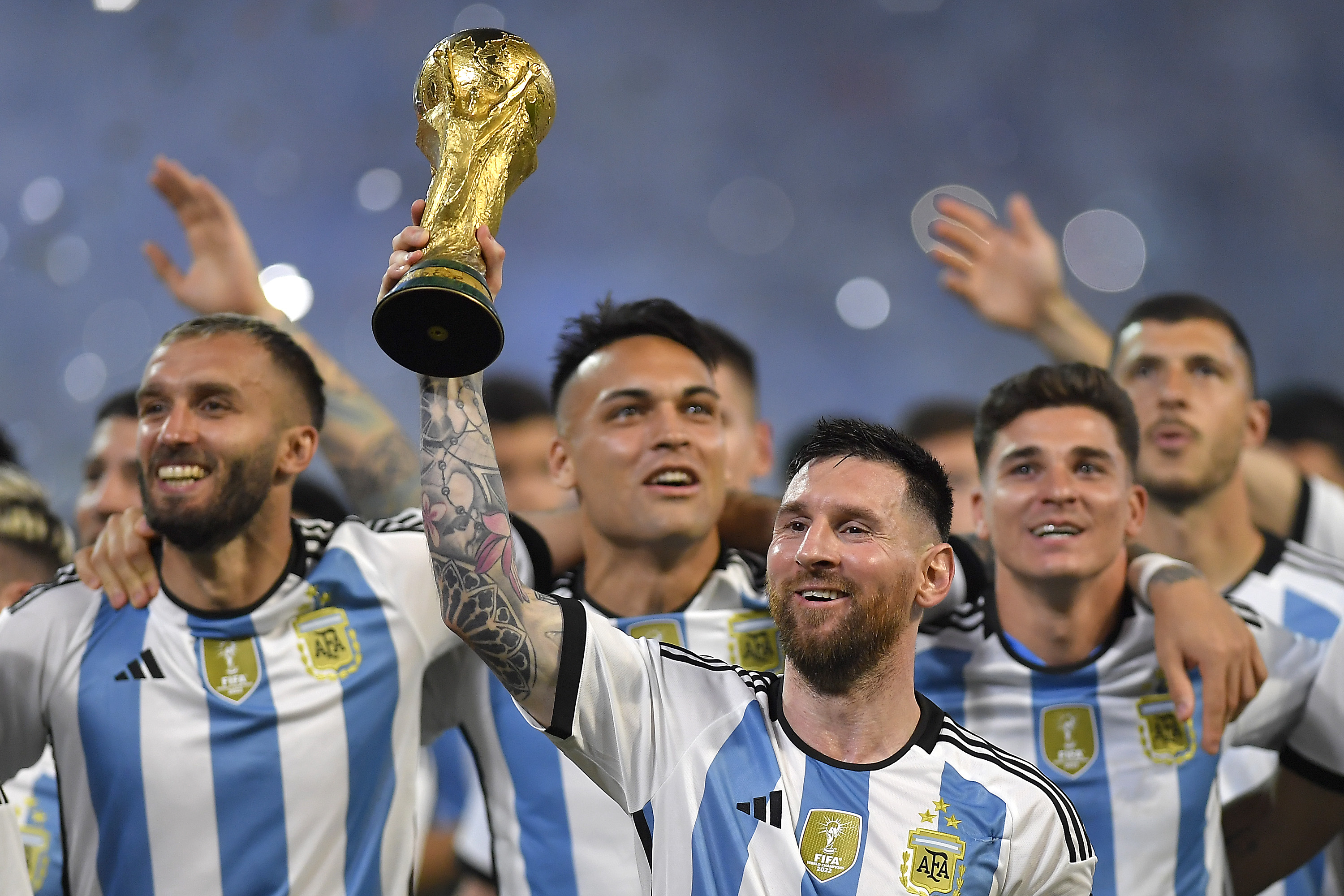 Lionel Messi with the World Cup trophy