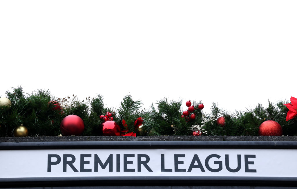 Christmas decorations above a Premier League sign