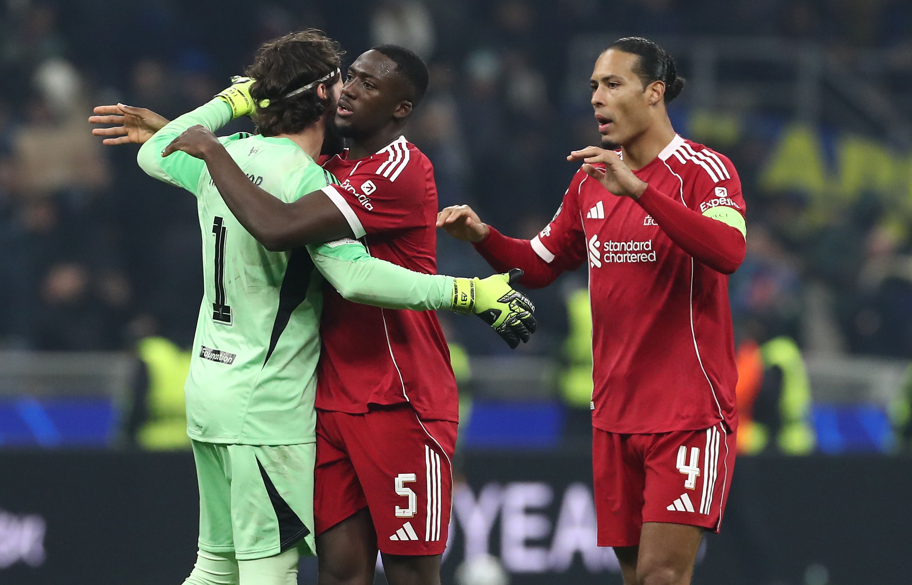 Virgil van Dijk (right) with Ibrahima Konate and Alisson