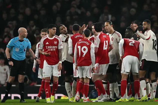 The Arsenal and Liverpool players confront each other