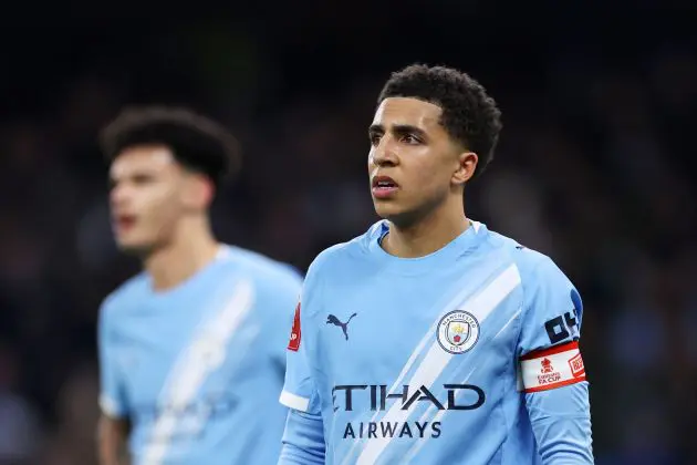 Rico Lewis wears the captain's armband for Manchester City (Photo by Lewis Storey/Getty Images)