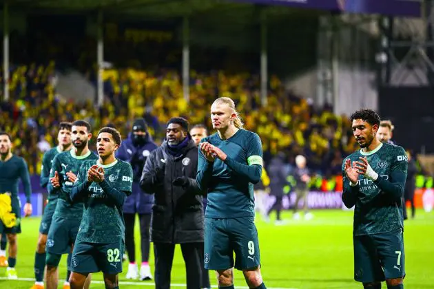 Man City players applaud the fans
