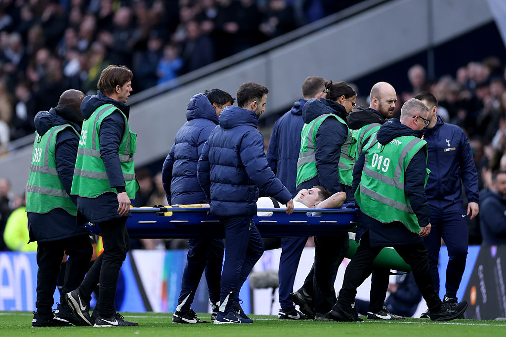 Ben Davies is taken off on a stretcher
