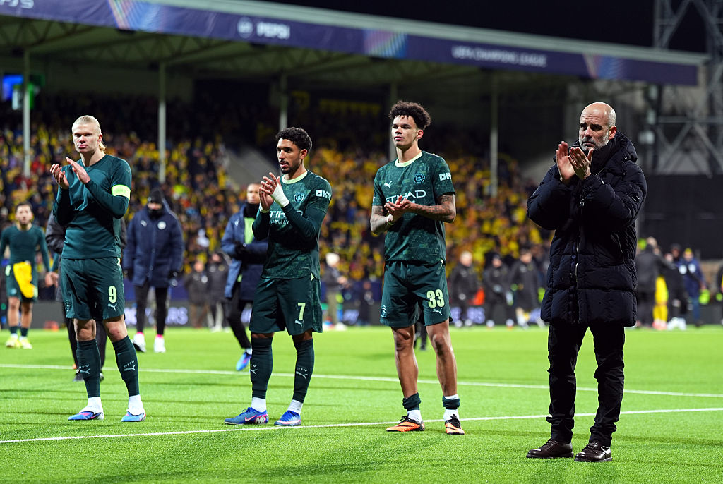 Pep Guardiola and his players applaud the Man City fans