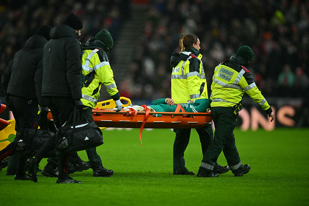 Wataru Endo is taken off on a stretcher