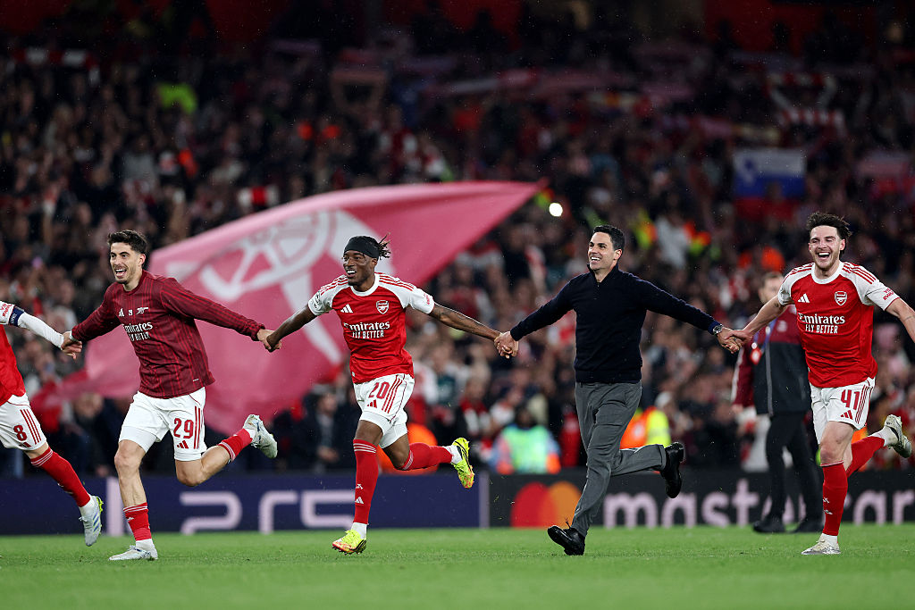 Mikel Arteta celebrates with his players