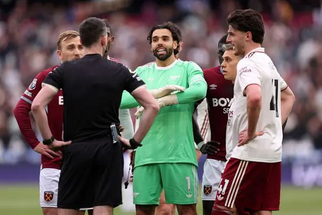 Referee Chris Kavanagh speaks to the players of both teams