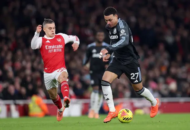 Aston Villa's Morgan Rogers takes on Arsenal's Leandro Trossard