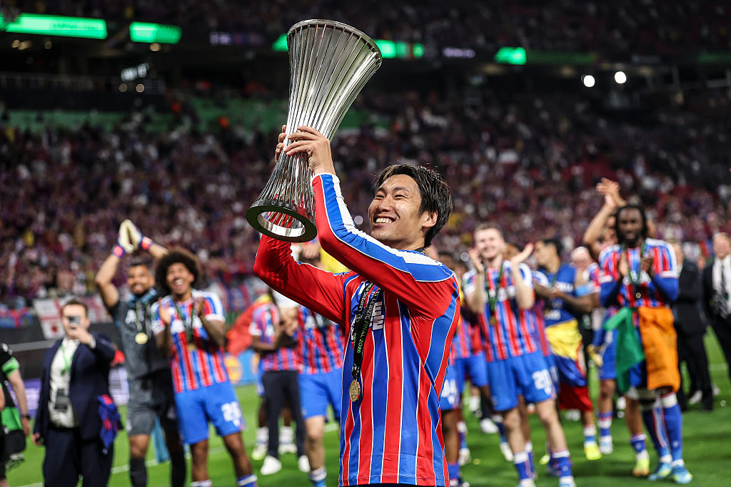 Daichi Kamada with the Conference League trophy