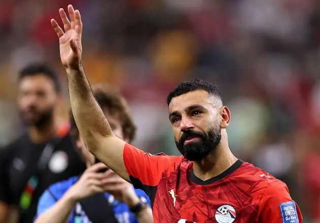 An emotional Mo Salah waves to the crowd