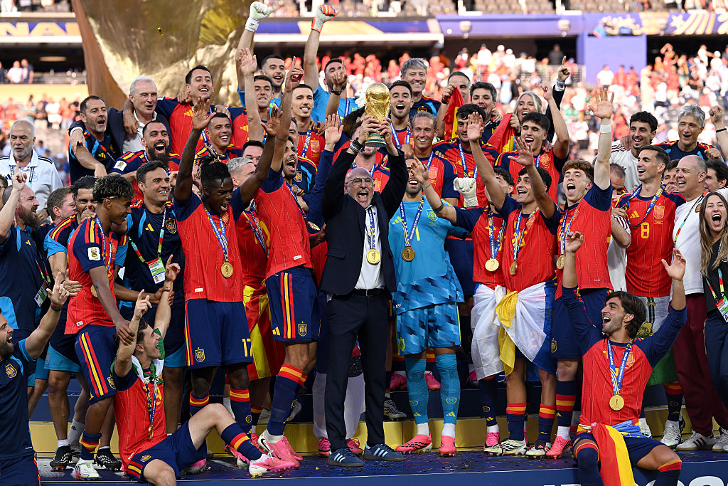 Spain celebrate with the World Cup trophy