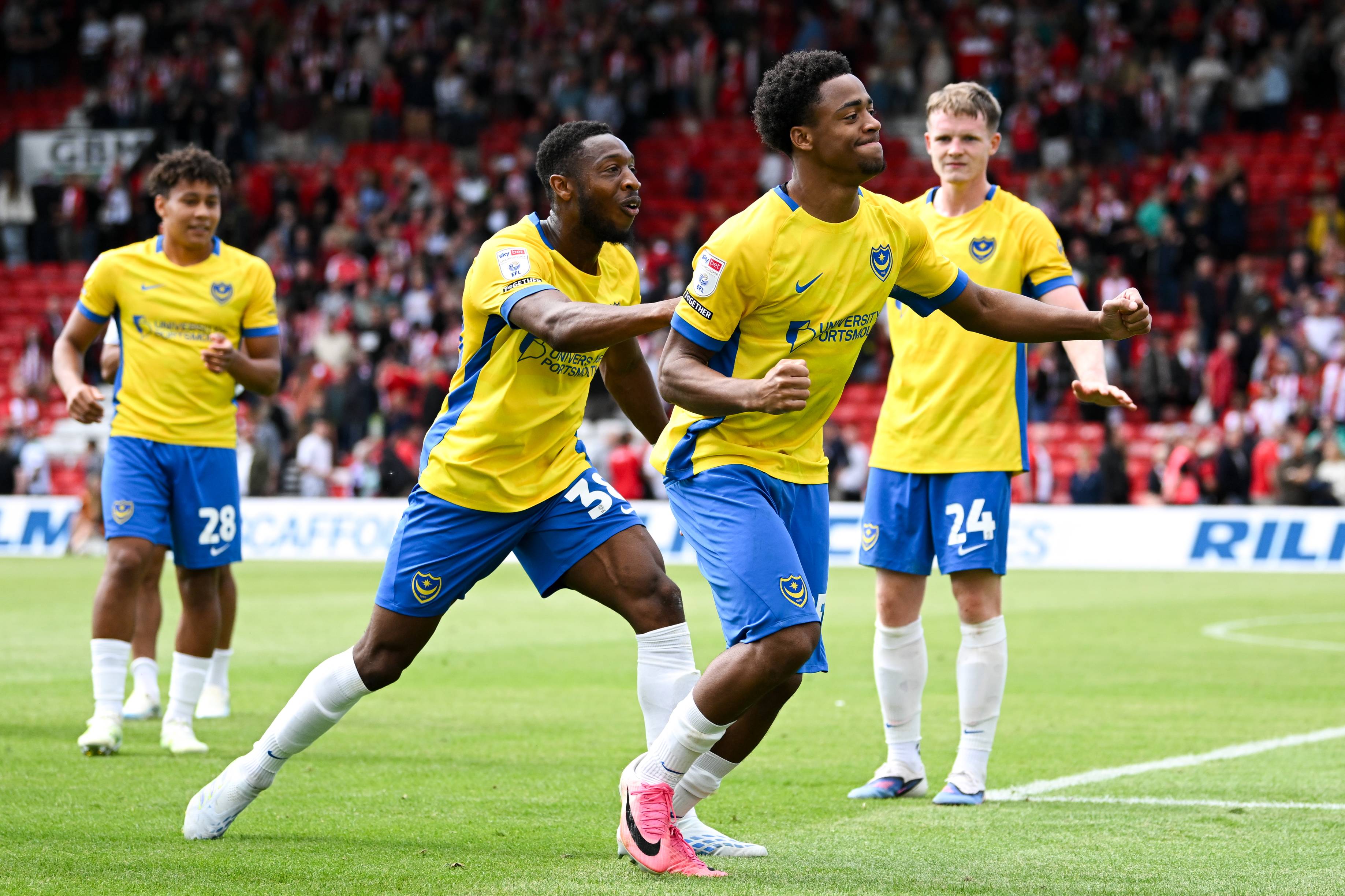 Ryan Kavuma-McQueen celebrates for Portsmouth