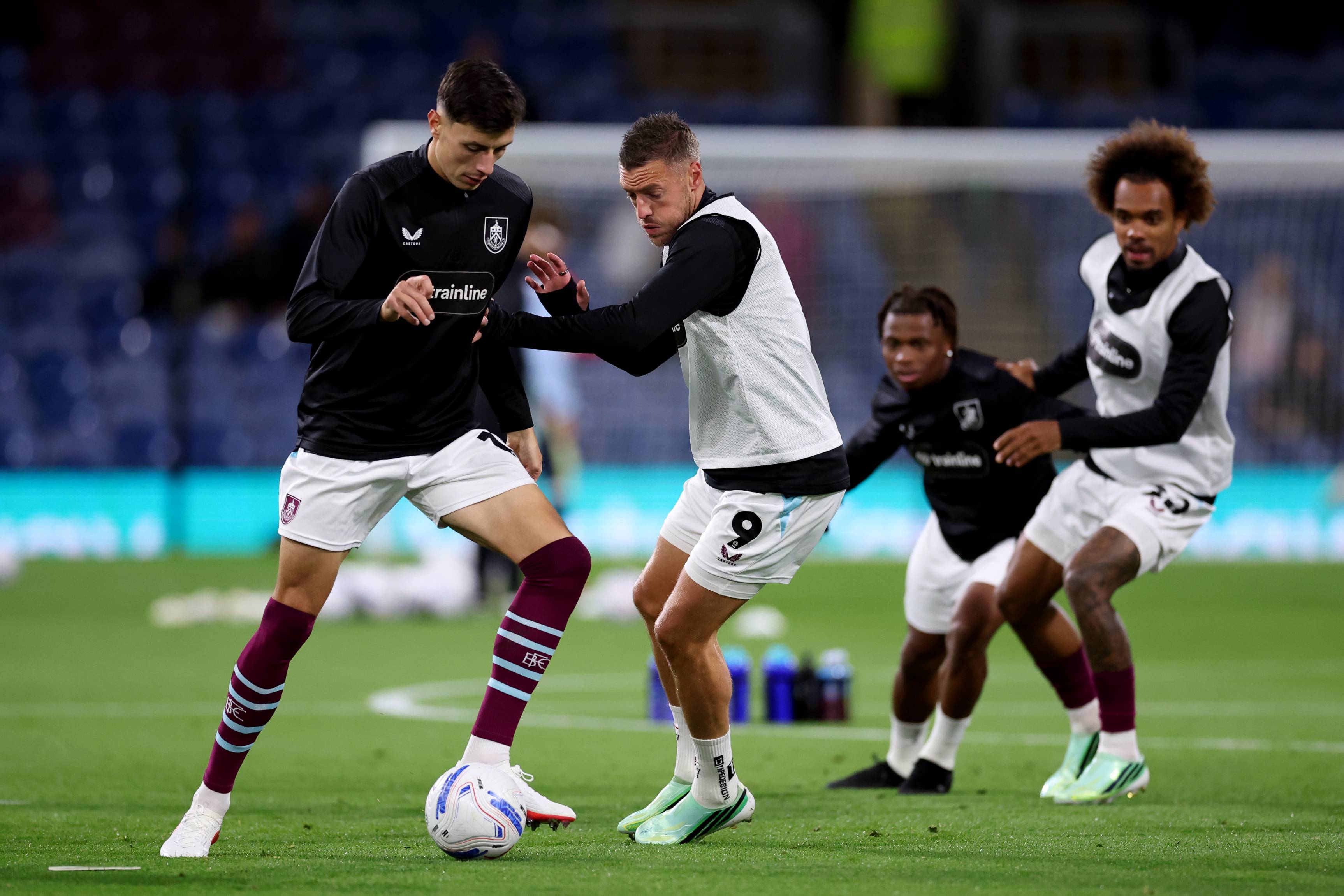 Ahmedhodzic warms up with his Burnley team-mates